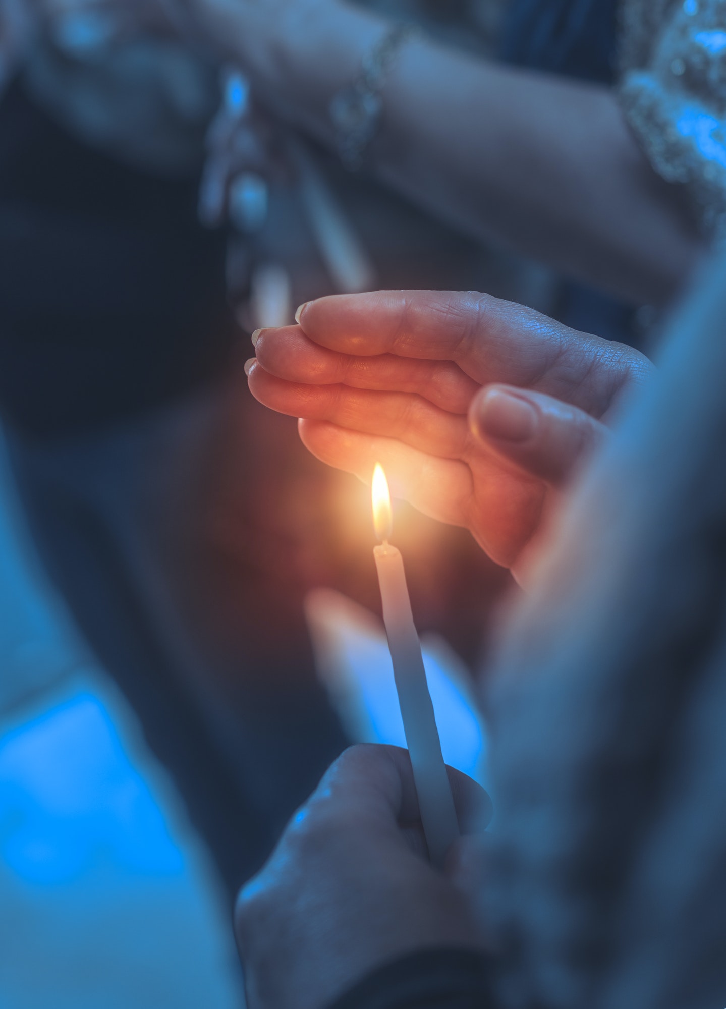 Believer in a church with candle